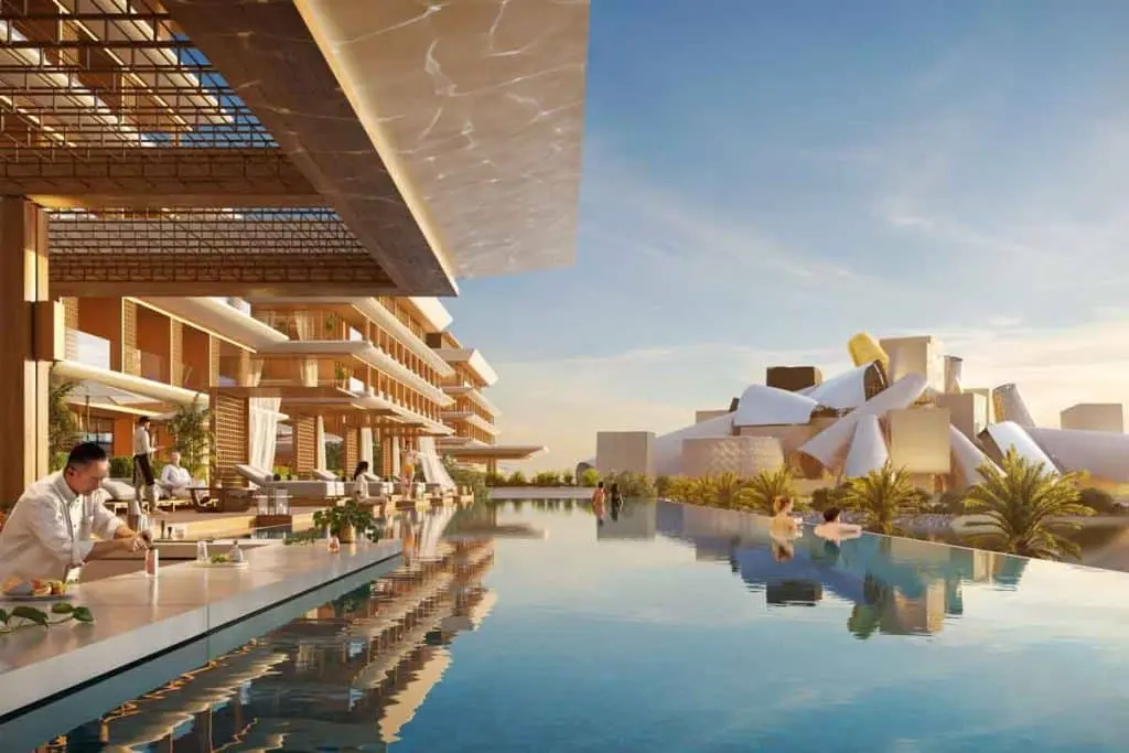 Sunset exterior view of the beachfront residential towers at Nobu Residences within the Saadiyat Cultural District, Abu Dhabi.