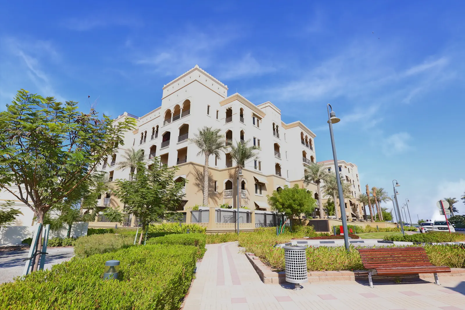Architectural exterior of Saadiyat Beach Residences highlighting its premium Mediterranean aesthetic.