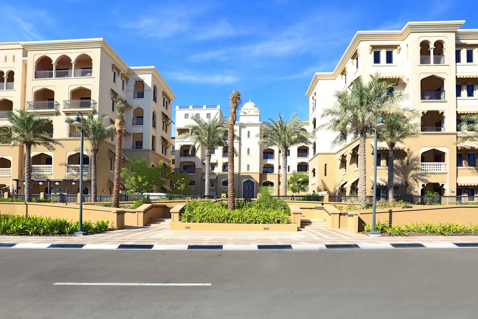Saadiyat Beach Residences community exterior with landscaped walkways and green open spaces.