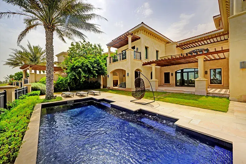 Private swimming pool surrounded by gardens at St. Regis Saadiyat Villa.jpg